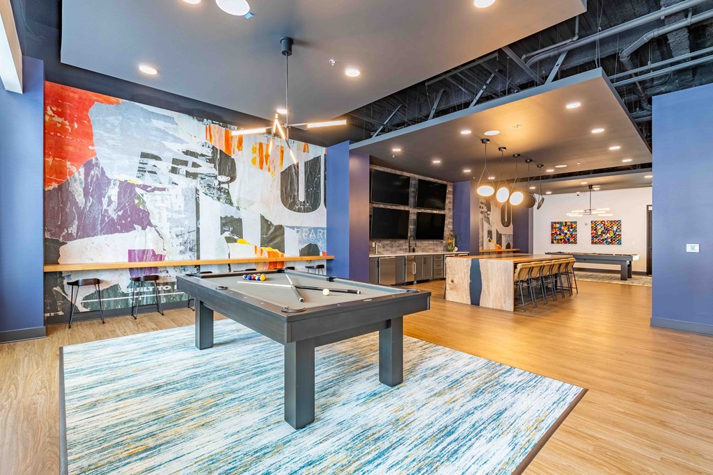 a games room with a pool table