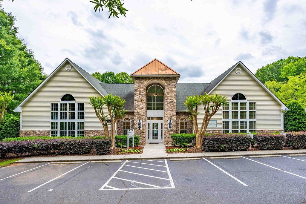 the front of a house with a parking lot
