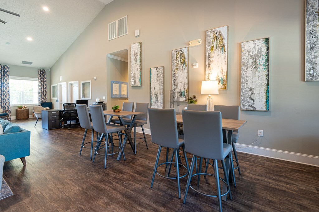 a dining room with a table and chairs