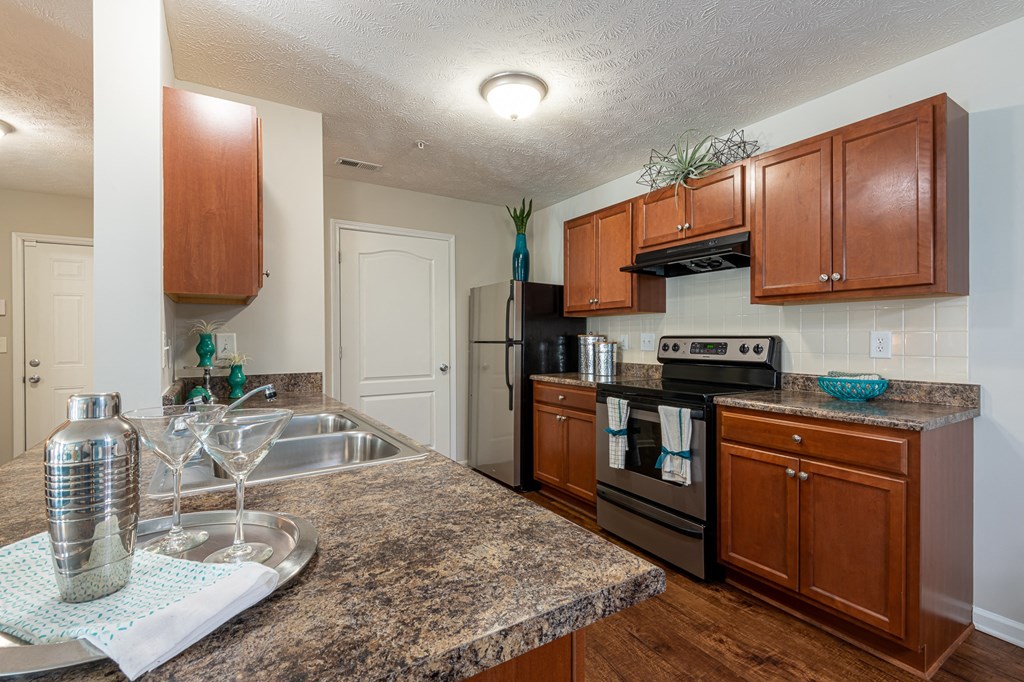 a kitchen with stainless steel appliances and granite counter tops