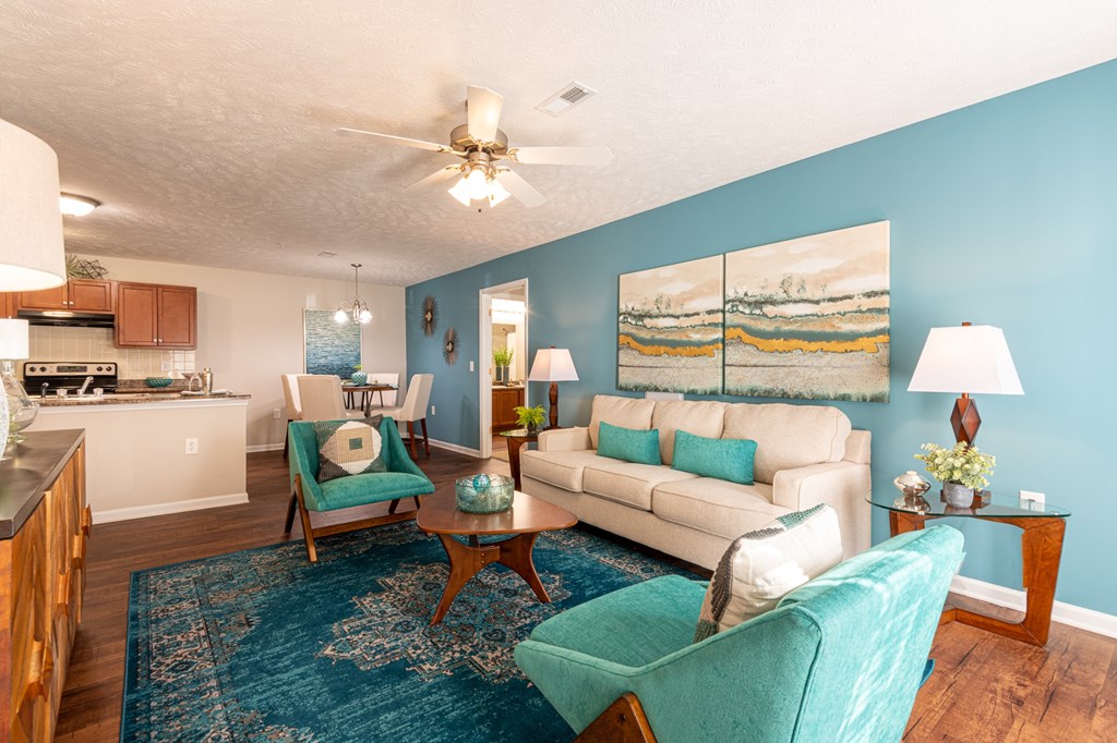 a living room with blue walls and a white couch