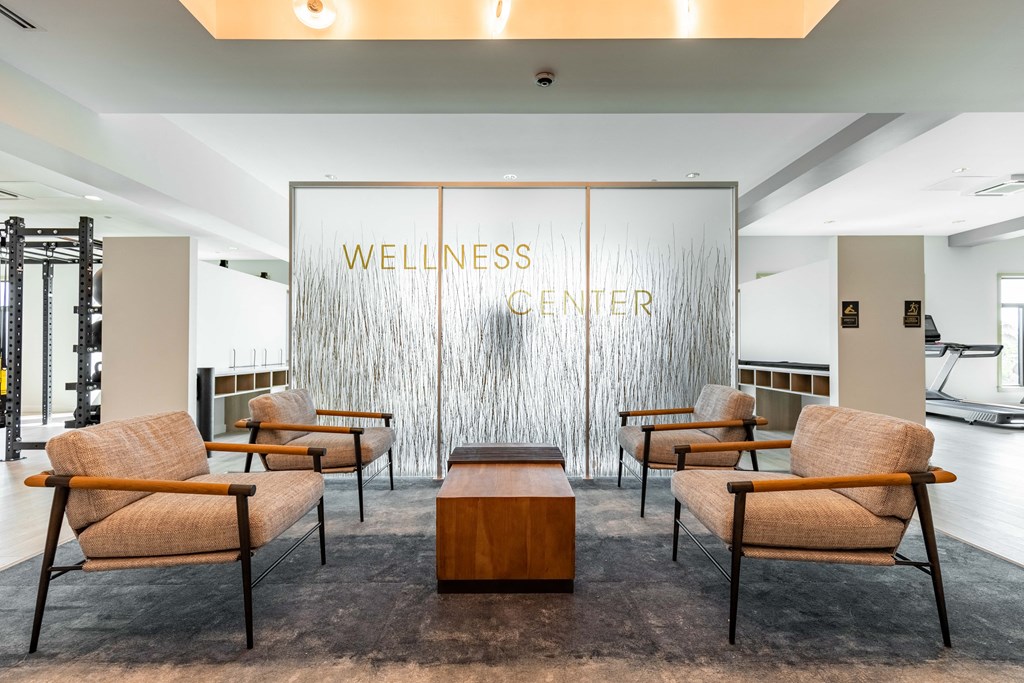the lobby of wellness center with chairs and a table
