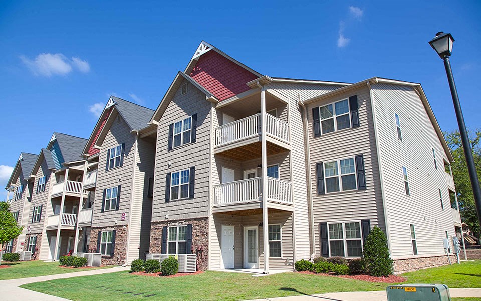 a building with multiple balconies and a street light