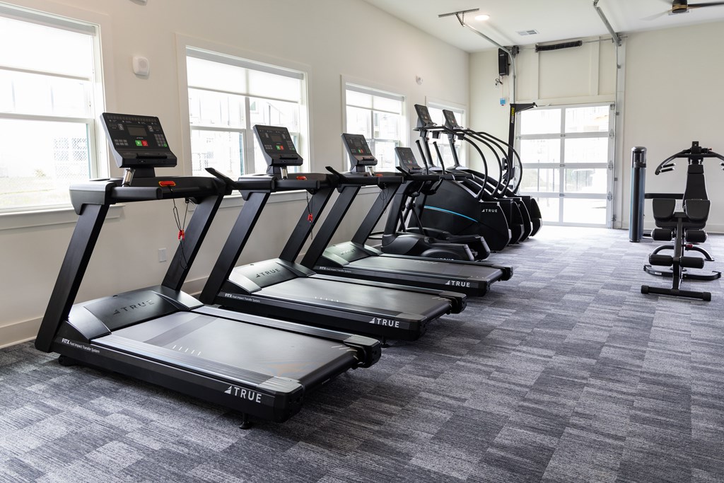 Fitness Center with treadmills and elliptical machines.