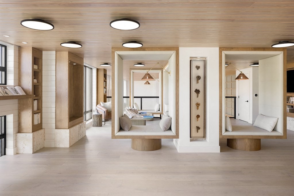 A modern interior with a wooden ceiling and white walls.