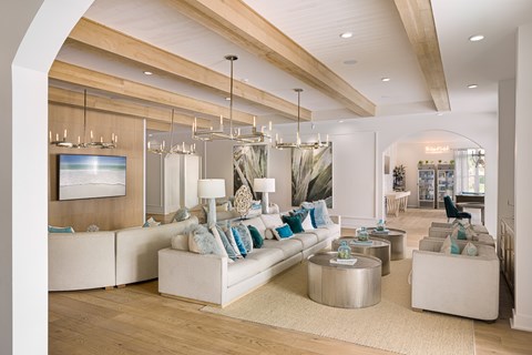 A modern living room with a white sofa and a wooden ceiling.