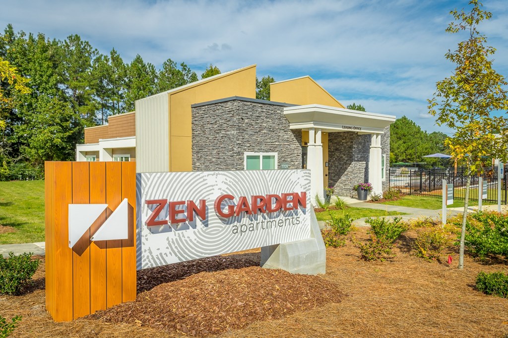 a zen garden sign in front of a house