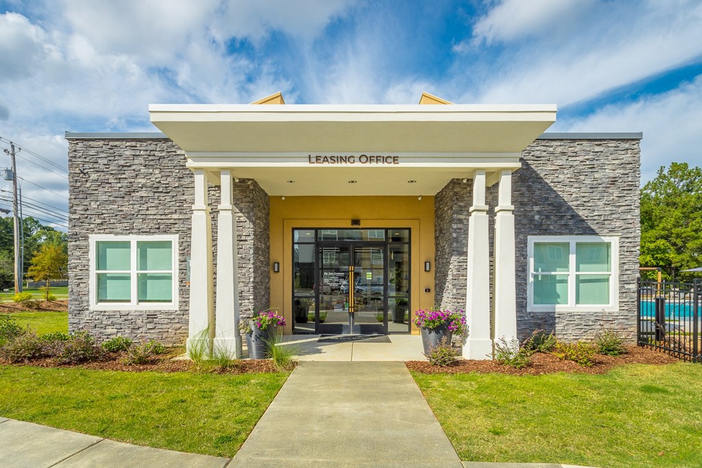 the entrance to the leasing office of the center building