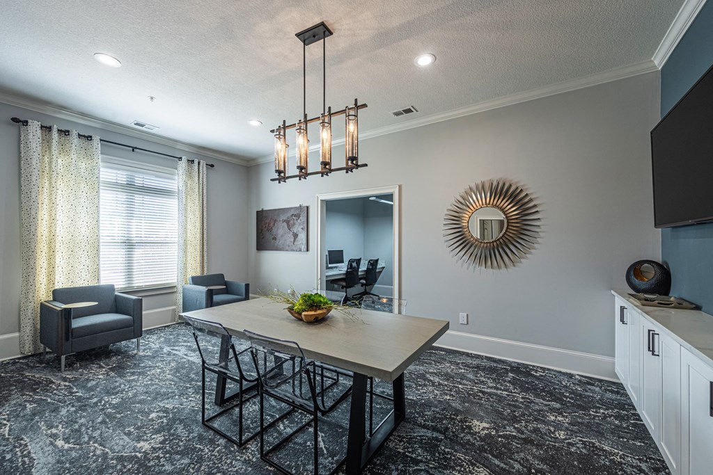 a dining room and living room with a table and chairs