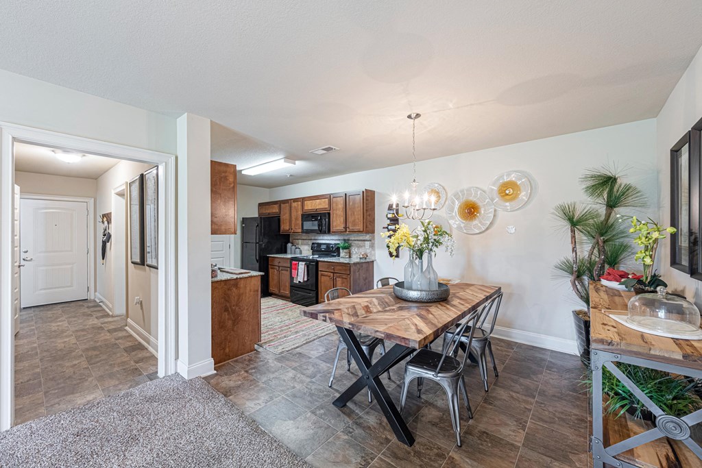 an open kitchen and dining room with a table and chairs