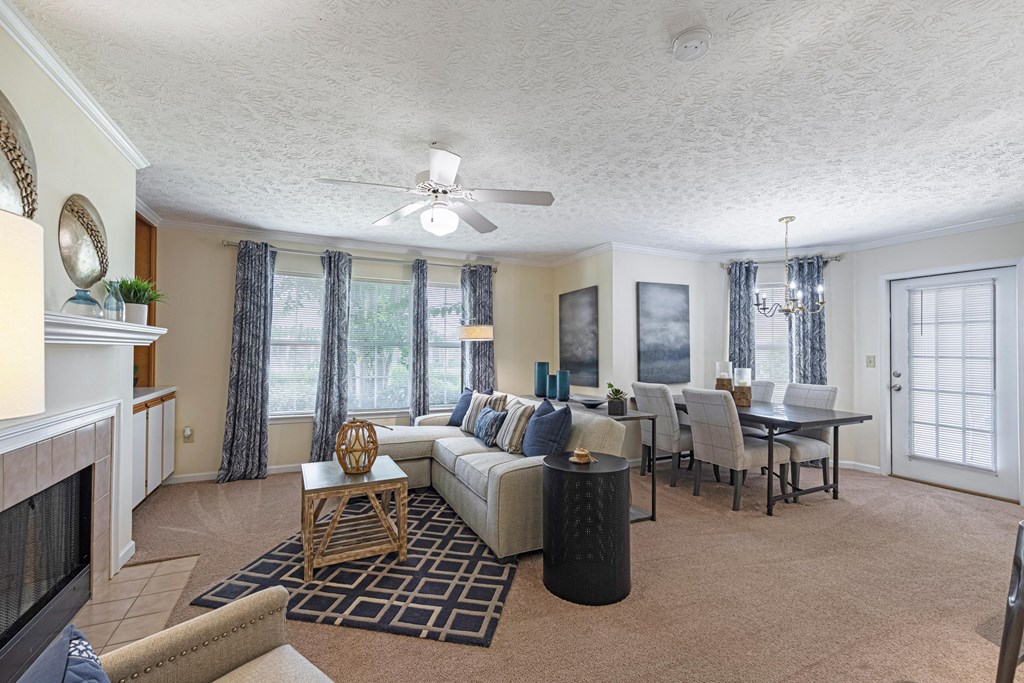 a living room and dining room with a couch and a table