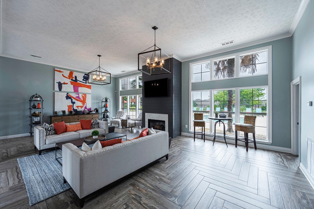 a living room with a couch and a table and a fireplace