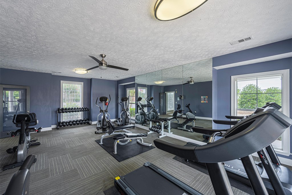 the gym at the enclave at deerwood apartments