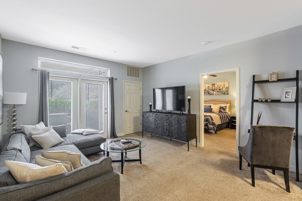 a living room with a couch and a tv