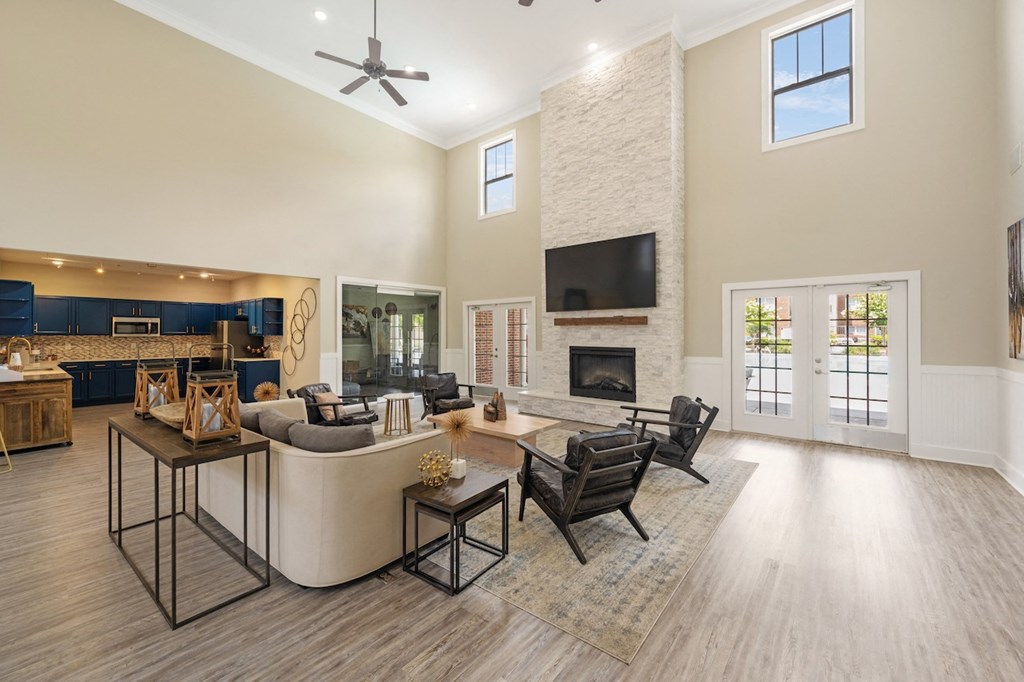 a living room with a couch and chairs and a fireplace