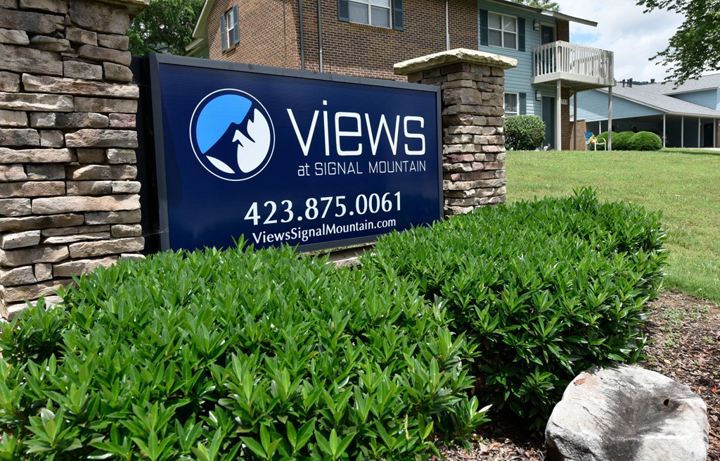 a sign in front of a building
