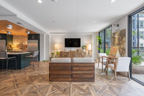 a living room and dining room with a couch and a table