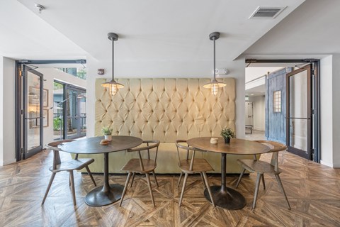 a dining room with a table and chairs