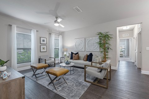 an open living room with a couch and chairs