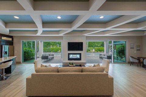 a large living room with a couch and a television