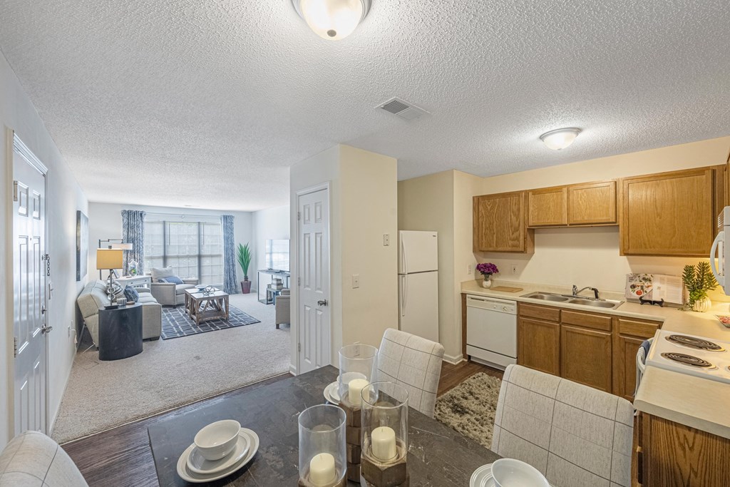a kitchen and living room with a dining room and a living room