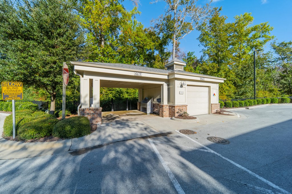 a parking lot with a garage door and a building
