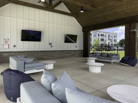A modern living room with a grey sofa and a white coffee table.