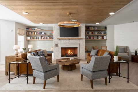 A living room with a fireplace and a television.
