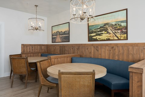 A dining area with a wooden table and chairs.