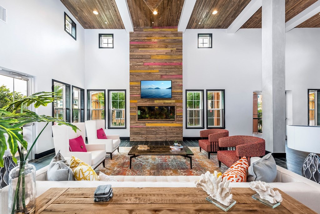 a living room with a couch and a table and a fireplace