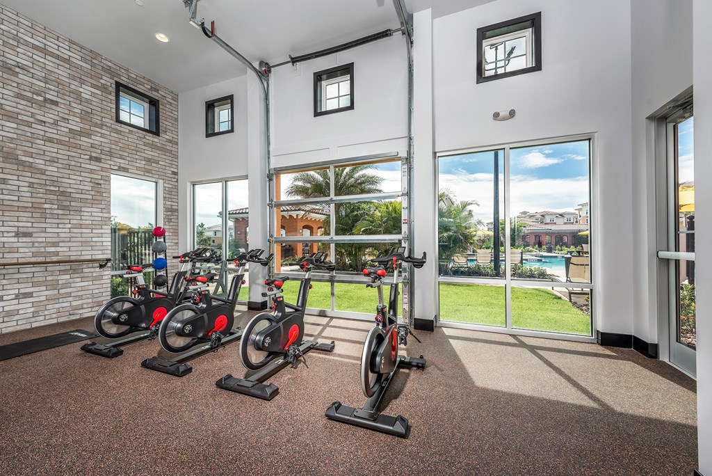 the residence apartments fitness center with exercise bikes