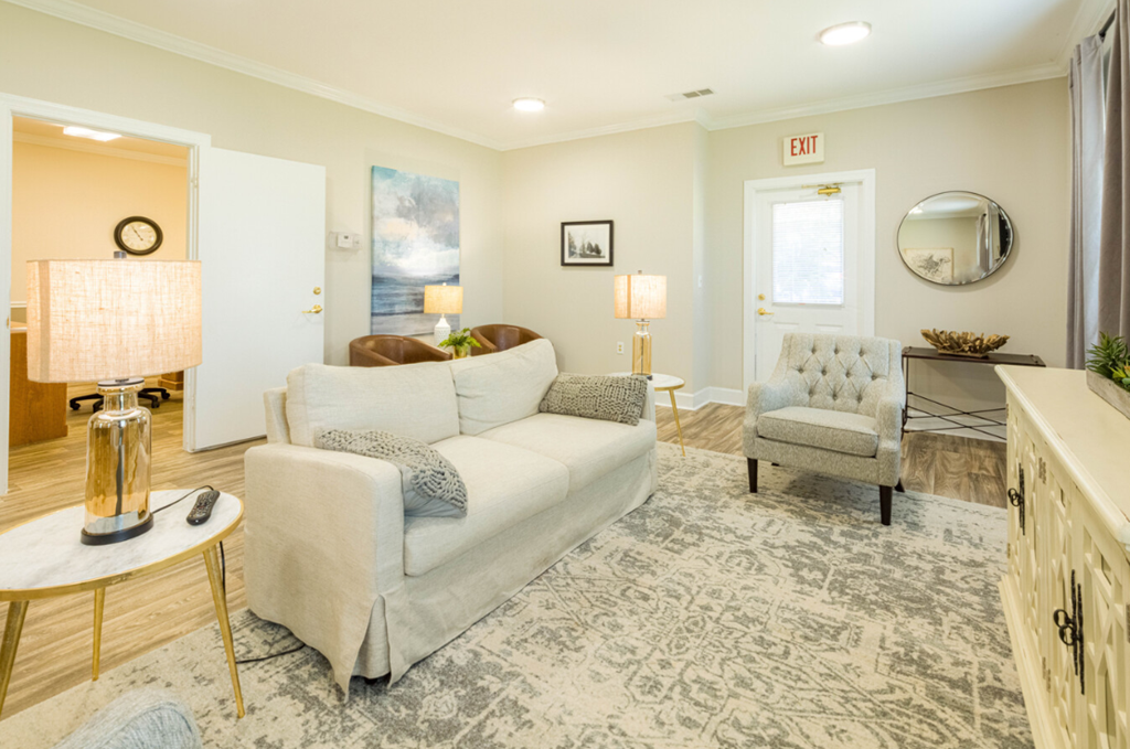 a living room with a couch and a chair