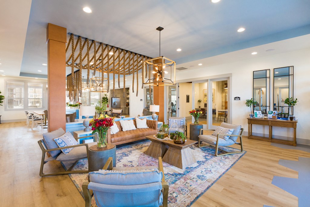 a living room with couches and chairs and a fireplace
