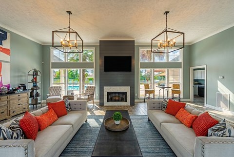 A living room with a fireplace and a television.