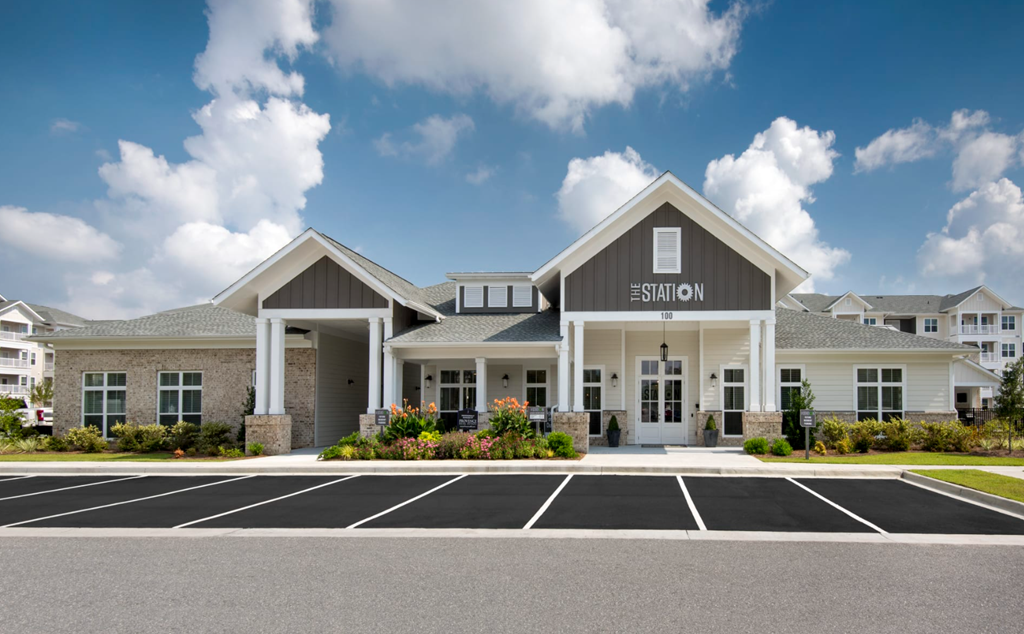 a large building with a parking lot in front of it