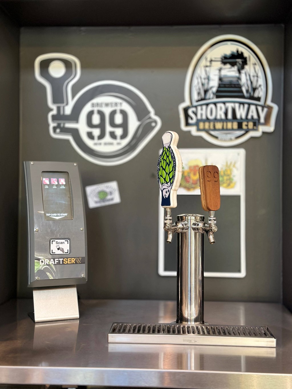 a beer dispenser and a bottle opener on a table