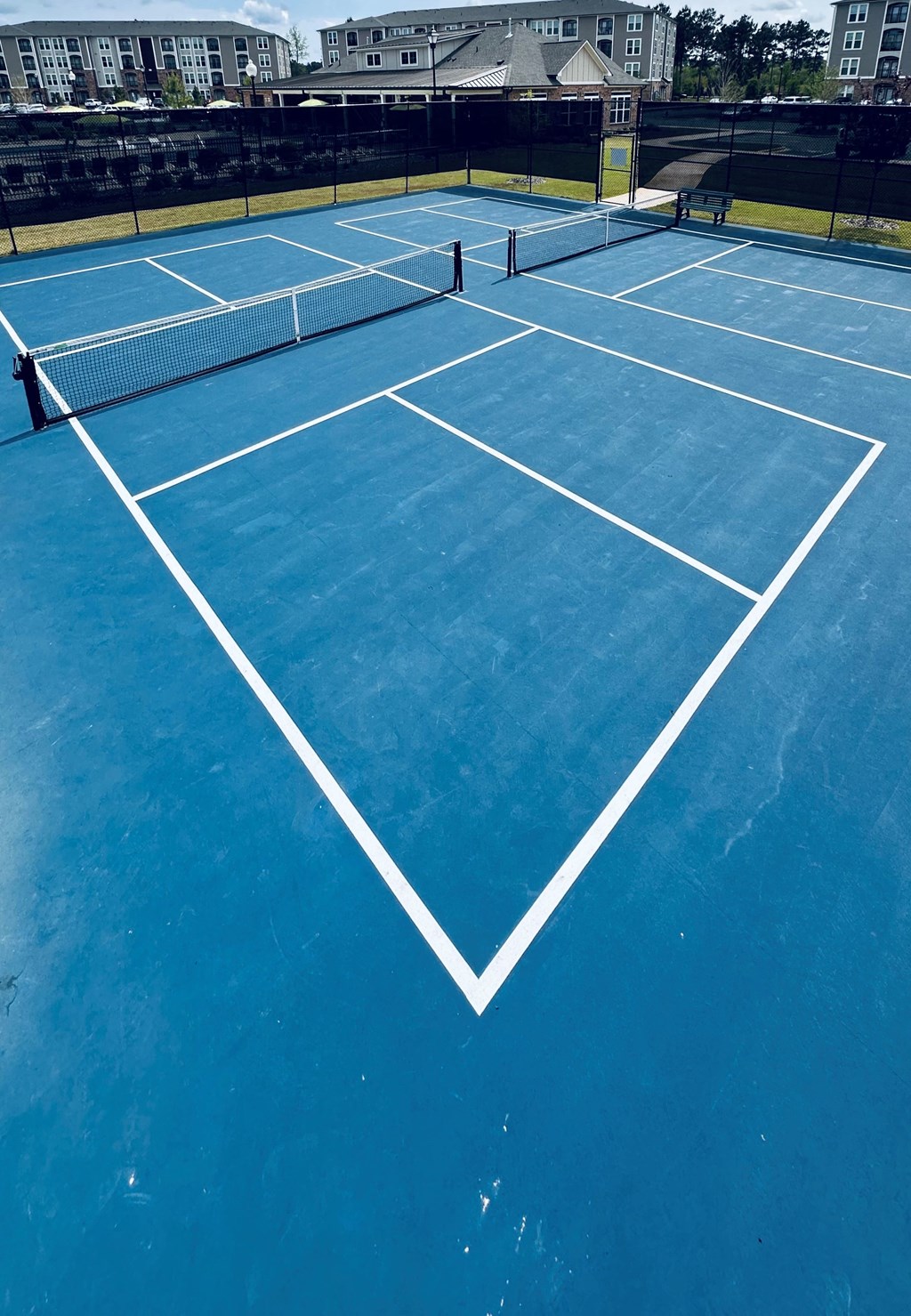 a blue tennis court with a net on it