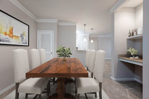 A dining room with a wooden table and chairs.