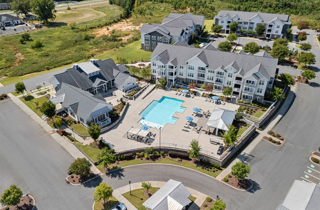 an aerial view of a large house with a swimming pool