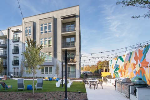 A modern apartment building with a colorful mural on the side.