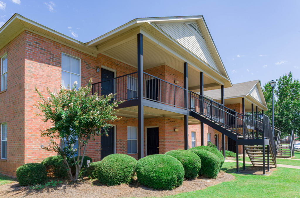 a house with a balcony and a staircase