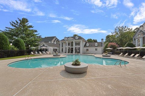 A large house with a pool in the backyard.