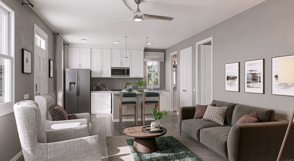 A modern living room with a grey couch, a white chair, and a coffee table.