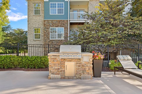 A building with a stone pillar in front of it.