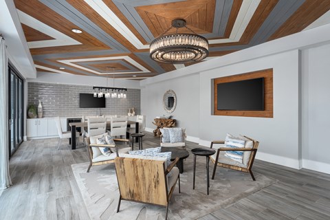 A modern dining room with a wooden table and chairs.