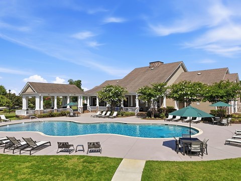 A large house with a pool in the backyard.