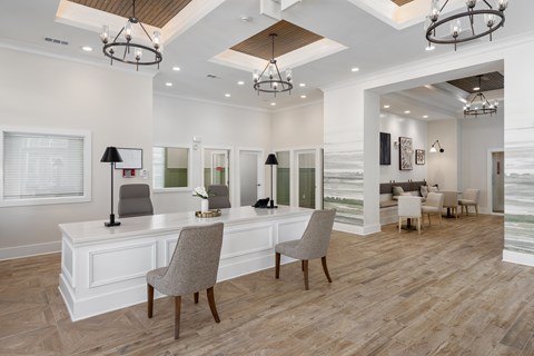 A well-lit, spacious office with a desk and chairs.
