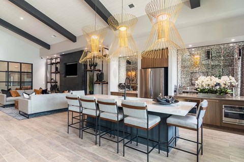 A modern dining room with a large table and chairs.