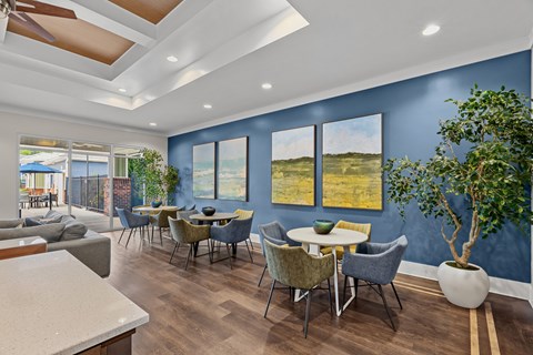 A modern dining room with a table set for six.