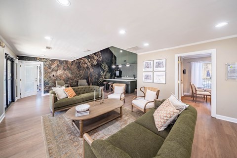 A living room with a green couch and a coffee table.